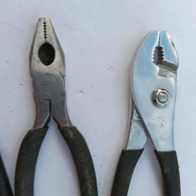 Assortment of black handled Pliers