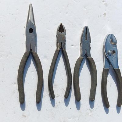 Assortment of black handled Pliers