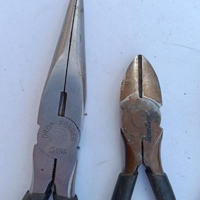 Assortment of black handled Pliers