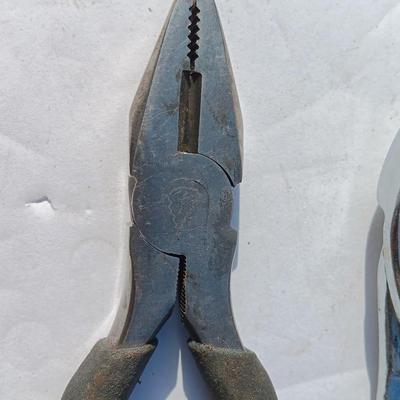 Assortment of black handled Pliers