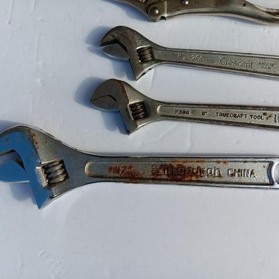 Adjustable wrenches and vise clamps