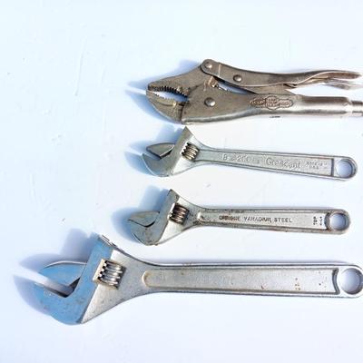 Adjustable wrenches and vise clamps