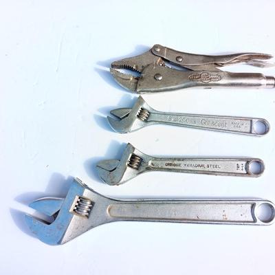 Adjustable wrenches and vise clamps
