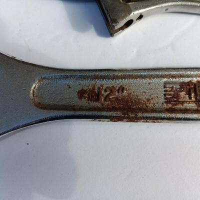 Adjustable wrenches and vise clamps