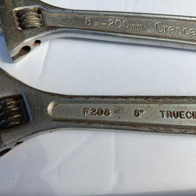 Adjustable wrenches and vise clamps