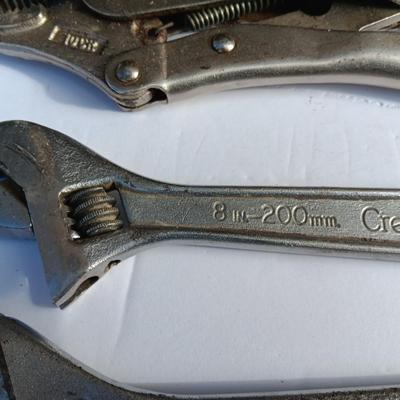 Adjustable wrenches and vise clamps