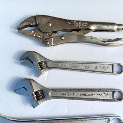 Adjustable wrenches and vise clamps