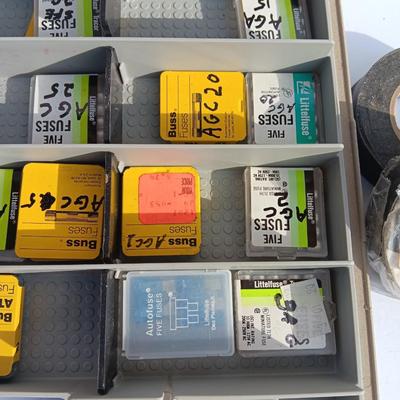 Organizer box with assortment of fuses and some hand tools