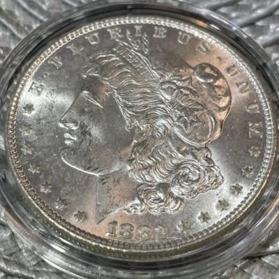 1882-P CHOICE UNCIRCULATED CONDITION MORGAN SILVER DOLLAR AS PICTURED.