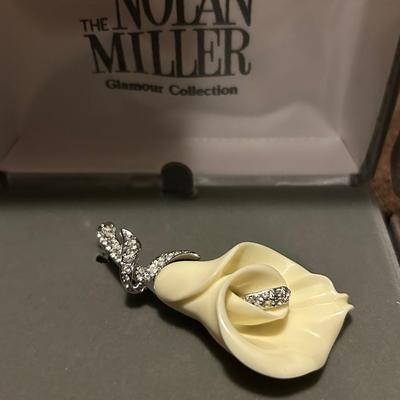 Nolan, Miller, flower, brooch, and rhinestone earrings, estate lot