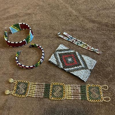 The state jewelry lot of four beaded bracelets.