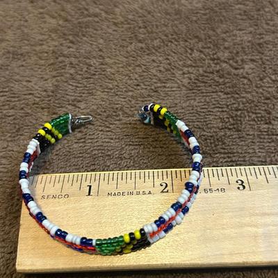 The state jewelry lot of four beaded bracelets.