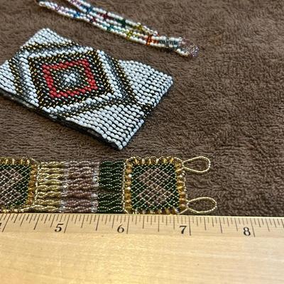 The state jewelry lot of four beaded bracelets.