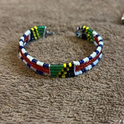 The state jewelry lot of four beaded bracelets.