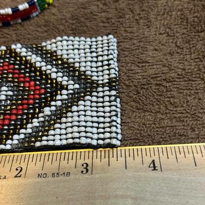 The state jewelry lot of four beaded bracelets.