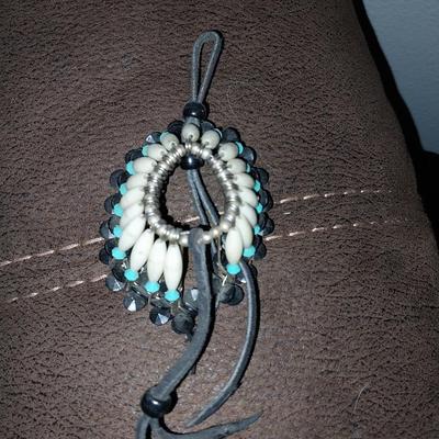 NATIVE AMERICAN HAND PAINTED WALL HANGING ON LEATHER