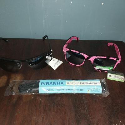 TWO PAIR NEW SUNGLASSES WITH TAGS AND PIRANHA EYEWARE CORD