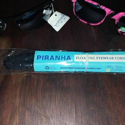 TWO PAIR NEW SUNGLASSES WITH TAGS AND PIRANHA EYEWARE CORD