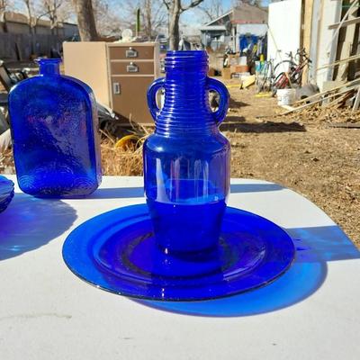 BLUE GLASS TWO BOTTLES AND PLATES