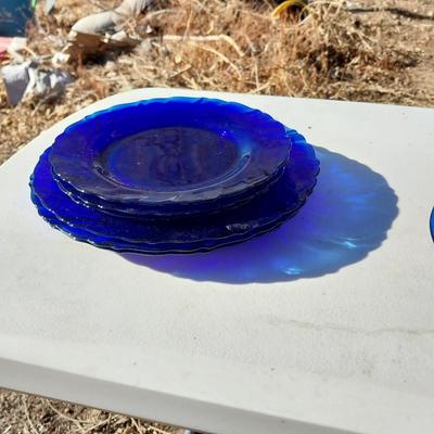 BLUE GLASS TWO BOTTLES AND PLATES