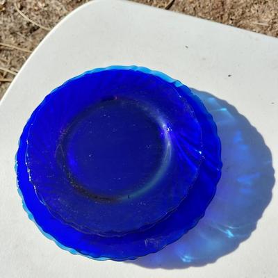 BLUE GLASS TWO BOTTLES AND PLATES