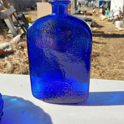 BLUE GLASS TWO BOTTLES AND PLATES