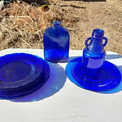 BLUE GLASS TWO BOTTLES AND PLATES