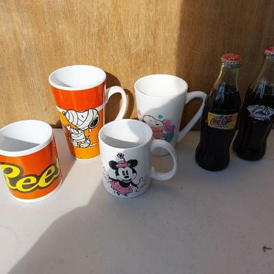 COLLECTABLE COKE BOTTLES AND MUGS