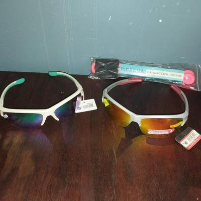 TWO NEW SUNGLASSES WITH TAGS AND PIRANHA CORD