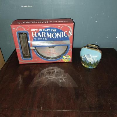 HARMONICA IN BOX AND PAINTED BRASS BELL