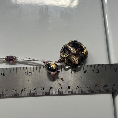 Handblown glass pendant on necklace with sterling silver clasp