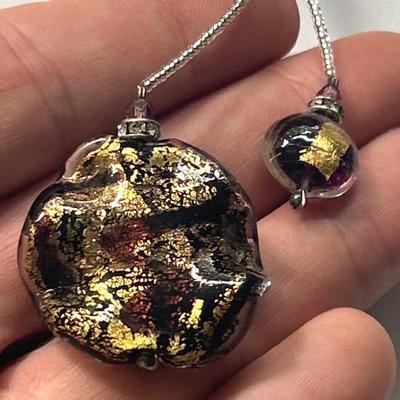 Handblown glass pendant on necklace with sterling silver clasp