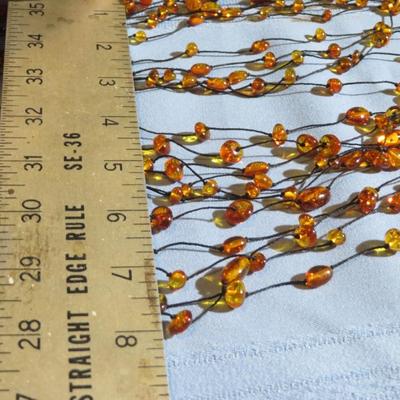 Multi strand Amber Bead Long Necklace.