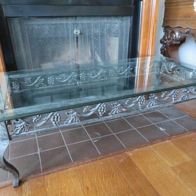 Glass top coffee table - Metal base with grape motif.