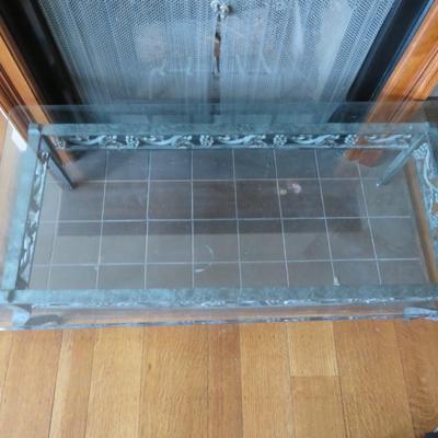 Glass top coffee table - Metal base with grape motif.