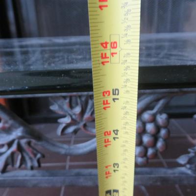 Glass top coffee table - Metal base with grape motif.