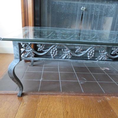 Glass top coffee table - Metal base with grape motif.