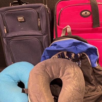 127- Two carry-on suitcases, neck pillows & backpack