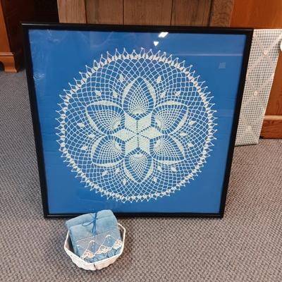 HANDMADE FRAMED DOILY AND TEA TOWELS IN A BASKET