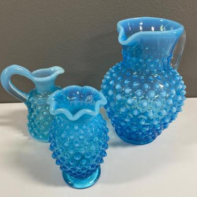 Blue opalescent hobnail pitchers