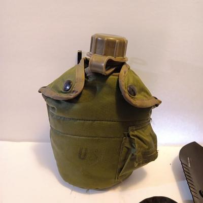 Survival Must haves - folding shovel with storage bag, Canteen with cooler pouch - and a Bushnell monocular