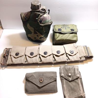 Military issued pouches and bags Ammunition with a canteen and first aid kit.