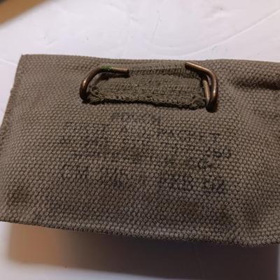Military issued pouches and bags Ammunition with a canteen and first aid kit.