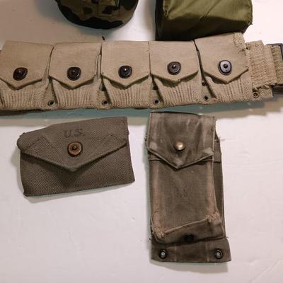 Military issued pouches and bags Ammunition with a canteen and first aid kit.