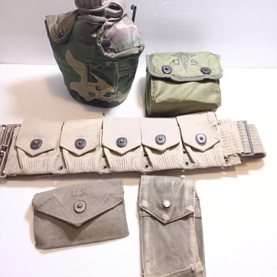 Military issued pouches and bags Ammunition with a canteen and first aid kit.