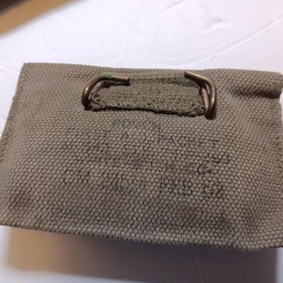 Military issued pouches and bags Ammunition with a canteen and first aid kit.