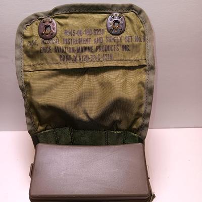 Military issued pouches and bags Ammunition with a canteen and first aid kit.