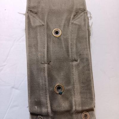 Military issued pouches and bags Ammunition with a canteen and first aid kit.