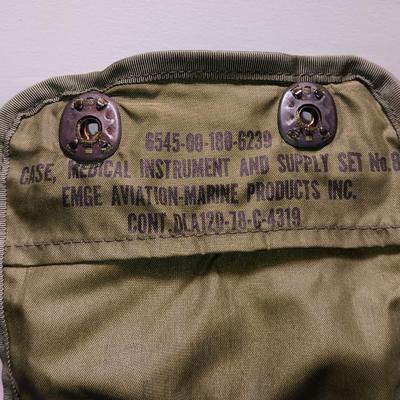 Military issued pouches and bags Ammunition with a canteen and first aid kit.