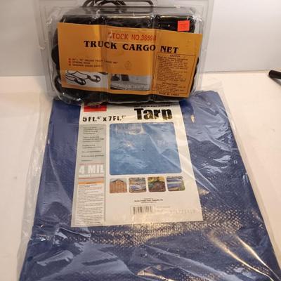 Brand new Truck cargo net with a new 5-foot x 7-foot blue colored tarp